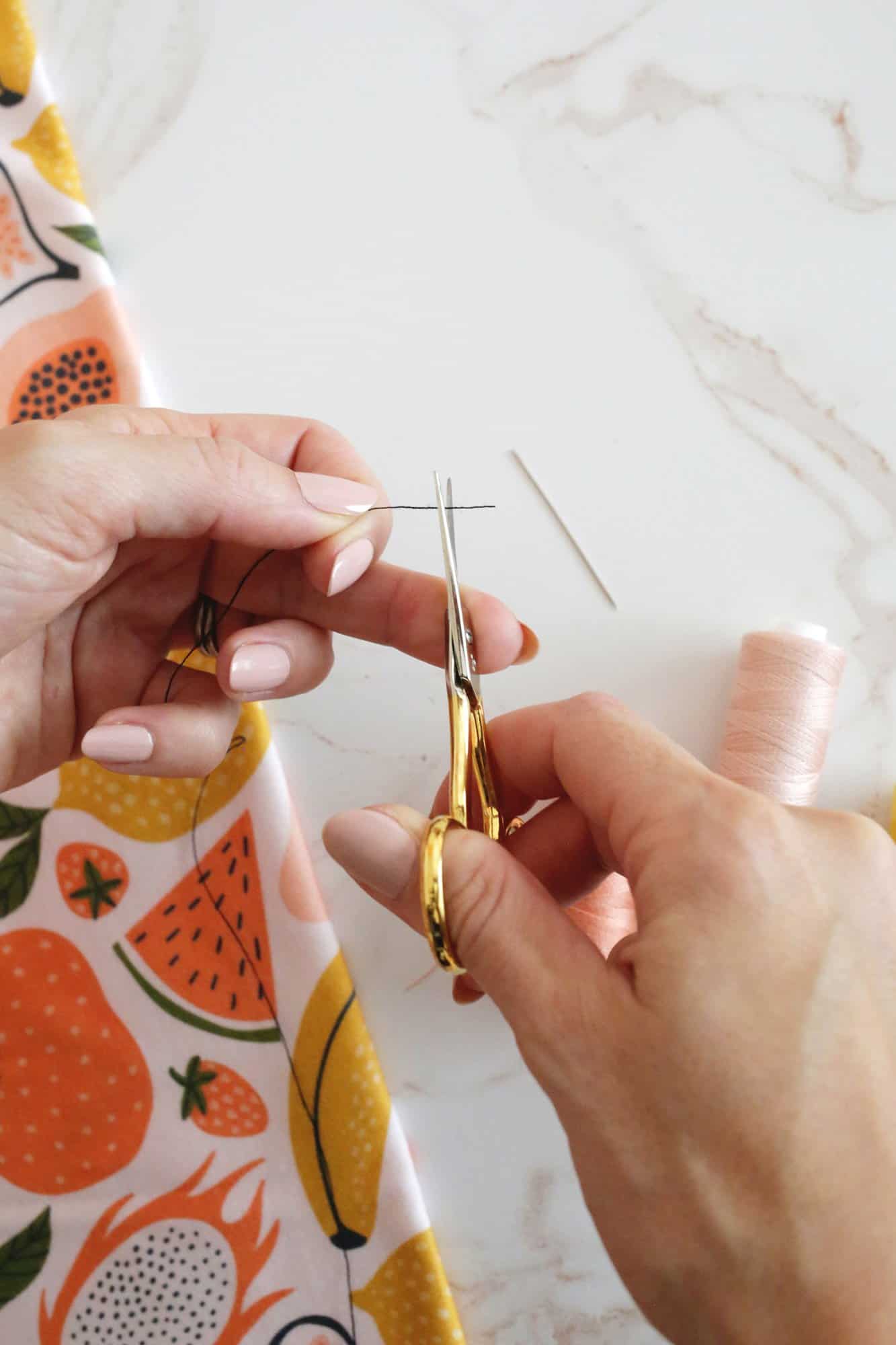 cutting a thread with scissors